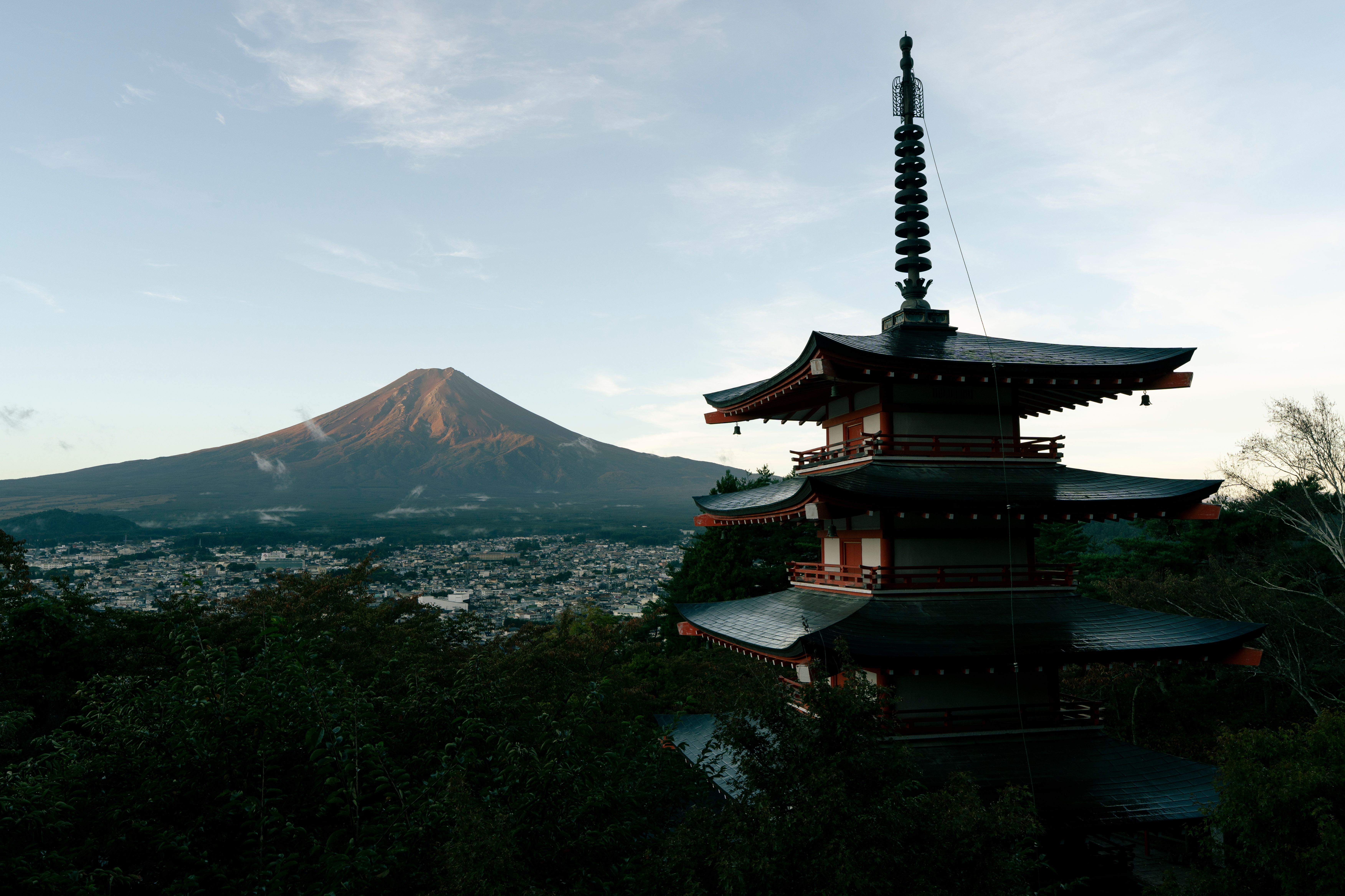 Mount fuji in golden morning sunlight with a padagoda in the front